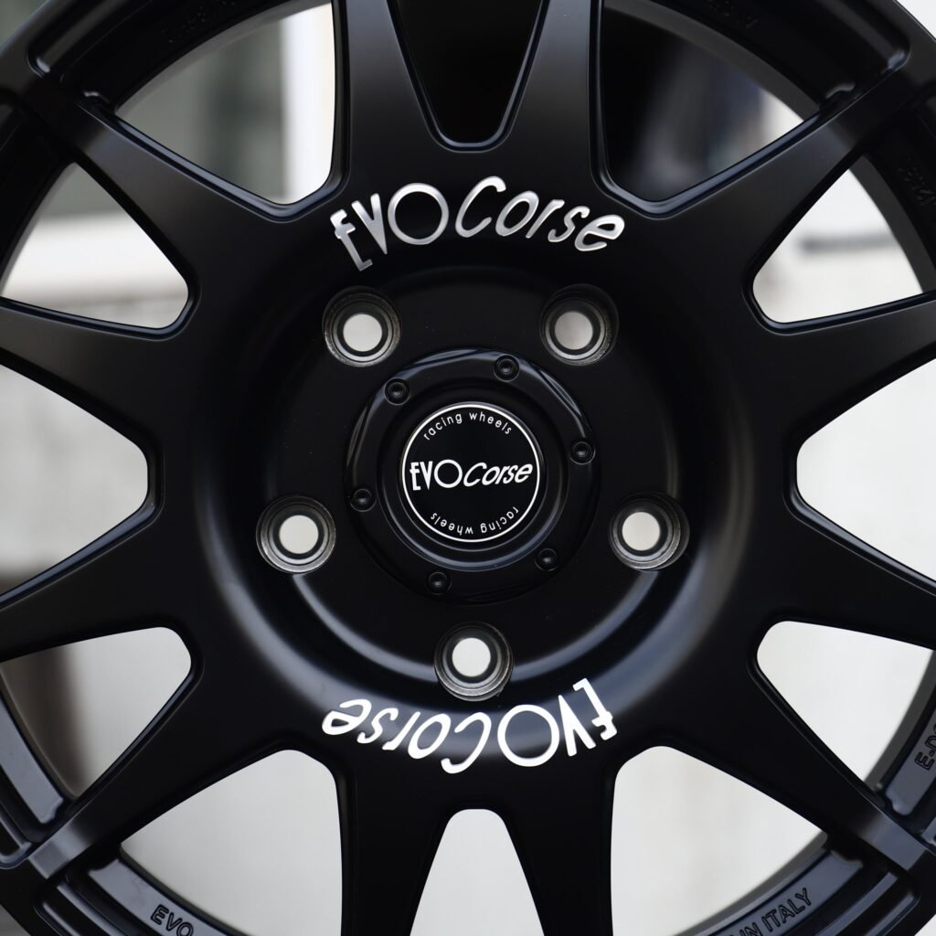 Jeep Gladiator wheels – Matte Black 12-Spoke Rally (EVO Corse-Style), angled view