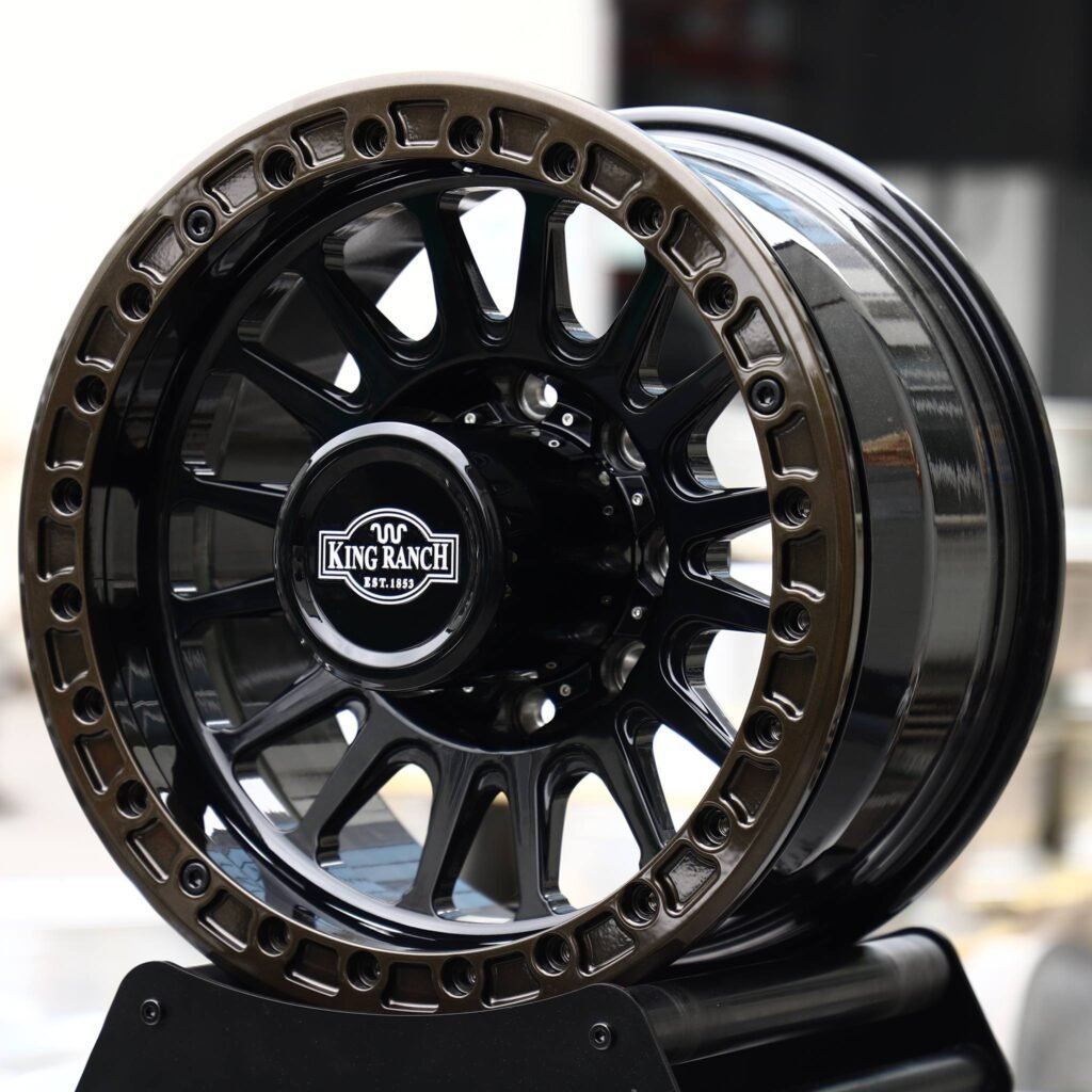 Ford F-250 Super Duty wheels – Gloss Black 15-Spoke Bronze-Ring Beadlock (Ford OEM-Style), angled view