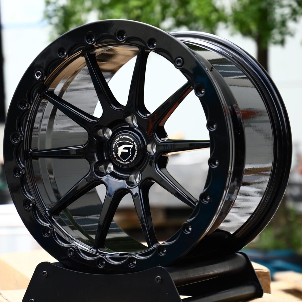 Ford Mustang wheels – Gloss Black 9-Spoke Beadlock (Forgestar-Style), angled view