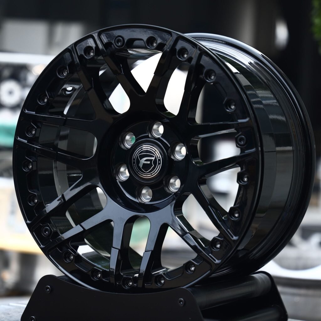 Ford Bronco wheels – Gloss Black Mesh Beadlock (Forgestar-Style), angled view