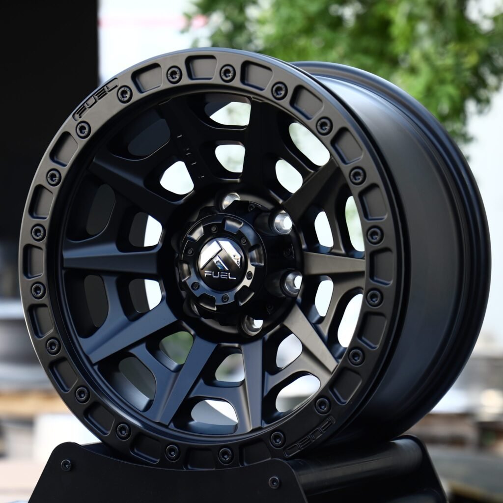 Toyota Tacoma wheels – Matte Black Offset-Spoke Bolt Ring Beadlock (Fuel-Style), angled view
