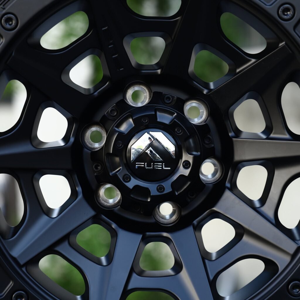 Chevrolet Silverado 1500 wheels – Matte Black Offset-Spoke Bolt Ring Beadlock (Fuel-Style), lip and barrel detail