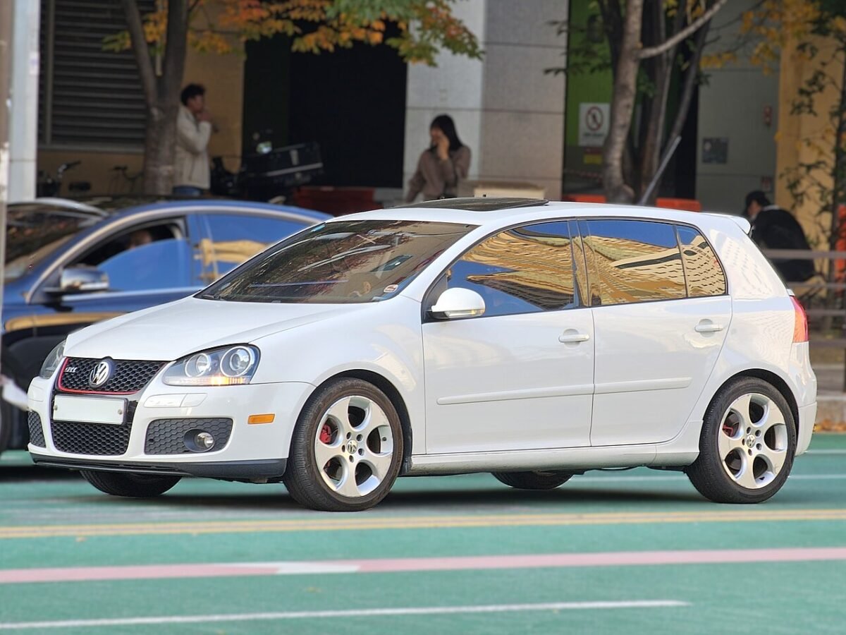 White Mk5 Volkswagen Golf GTI on factory 17-inch 5x112 ET51 wheels