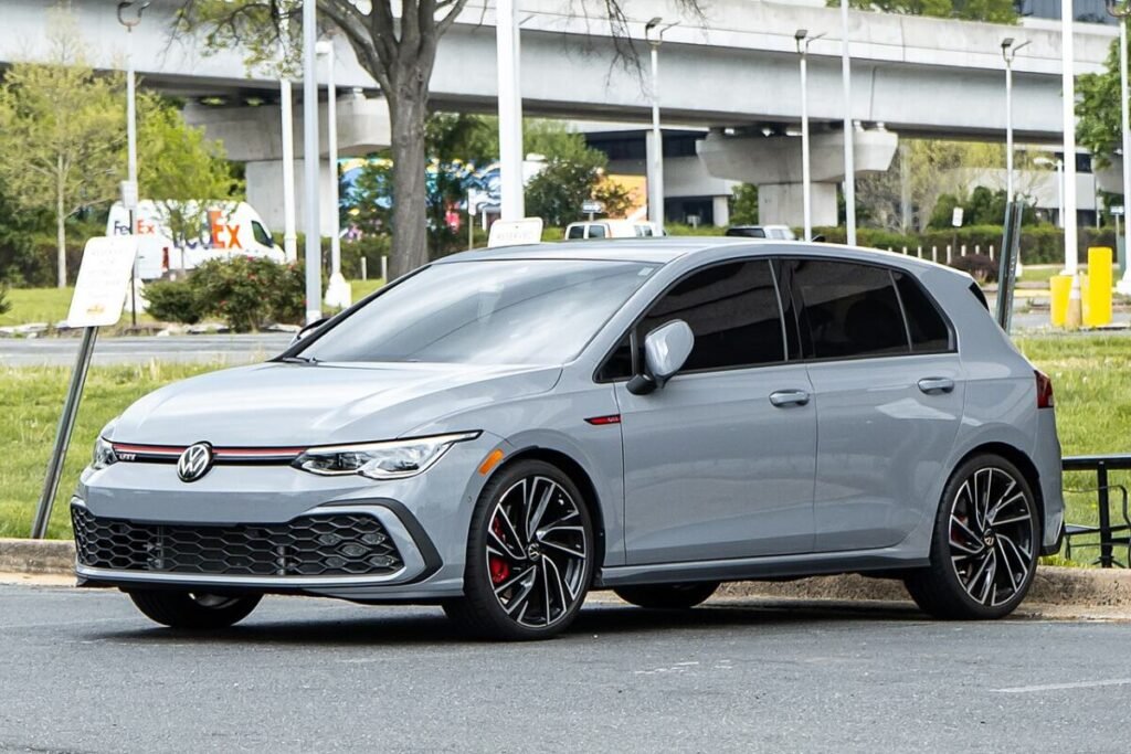 Grey Mk8 Volkswagen Golf GTI side view on factory 18-inch 5x112 wheels showing stock Golf GTI wheel offset