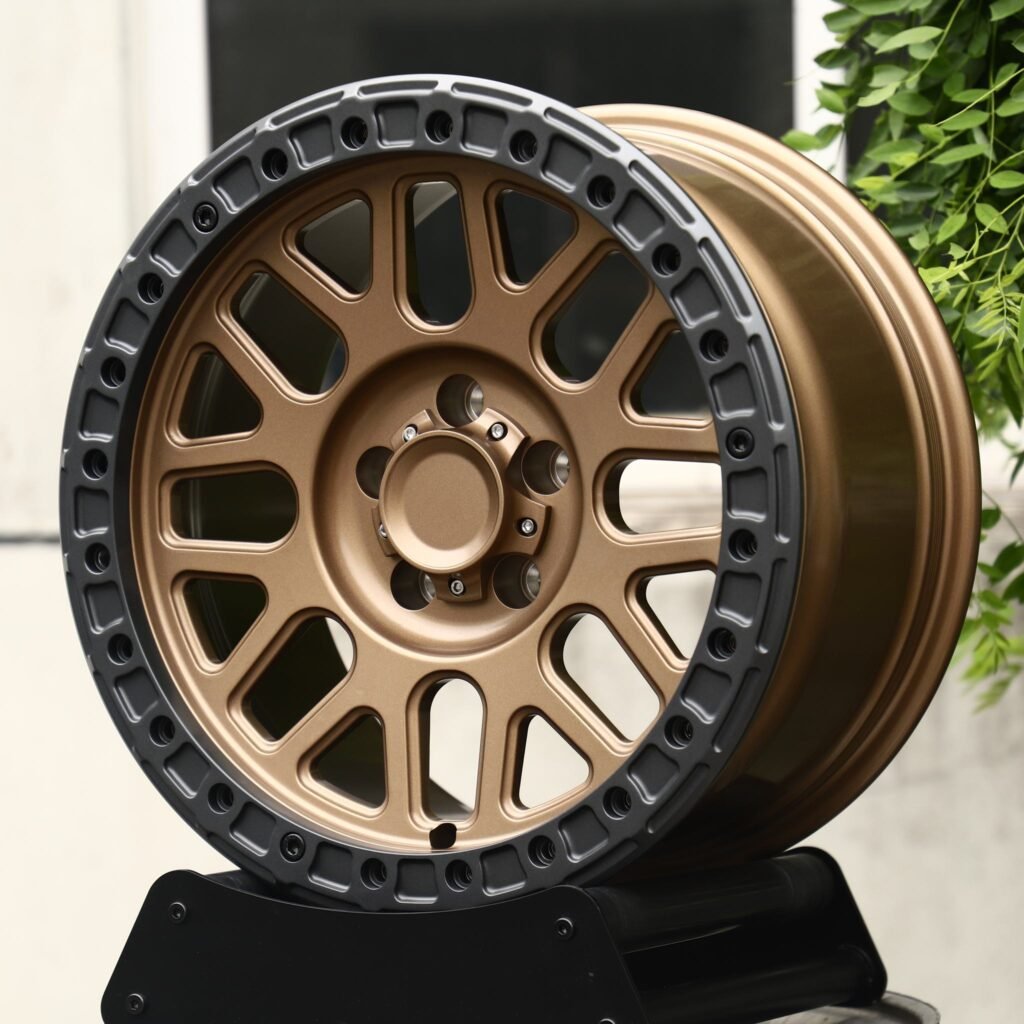 Land Rover Defender wheels – Matte Bronze 10-Spoke Gunmetal-Ring Beadlock, angled view