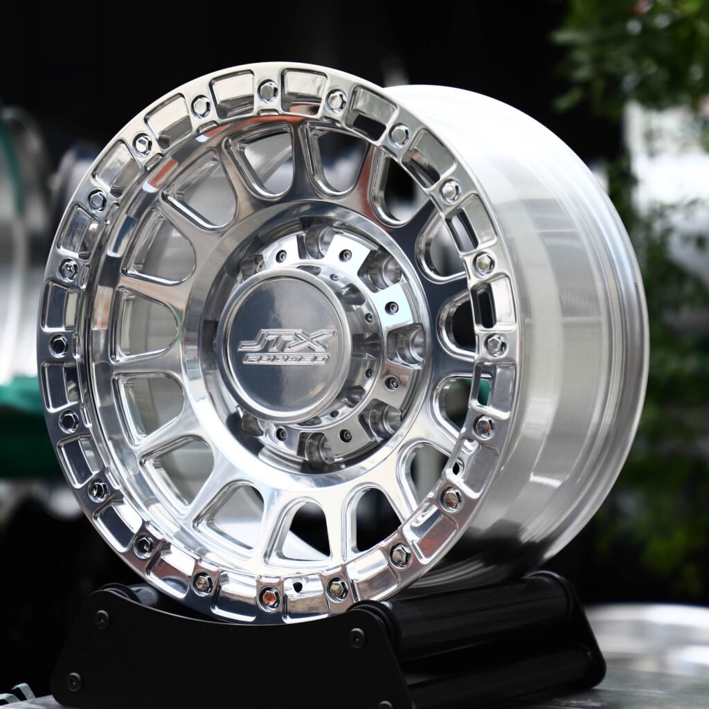 Ram 2500 wheels – Polished 16-Spoke Bolted Ring Beadlock (JTX Forged-Style), angled view