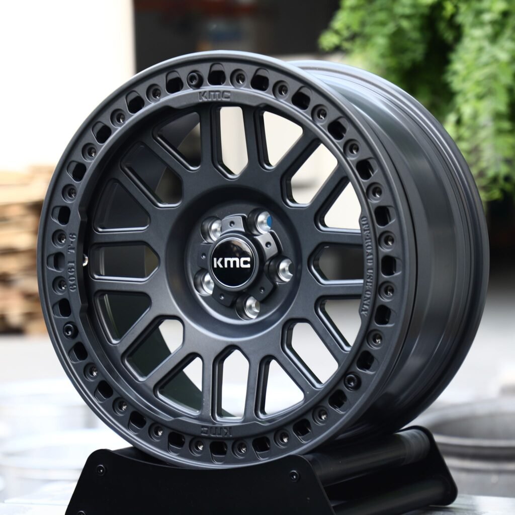 Toyota Tacoma wheels – Matte Black 10-Spoke Beadlock (KMC-Style), angled view