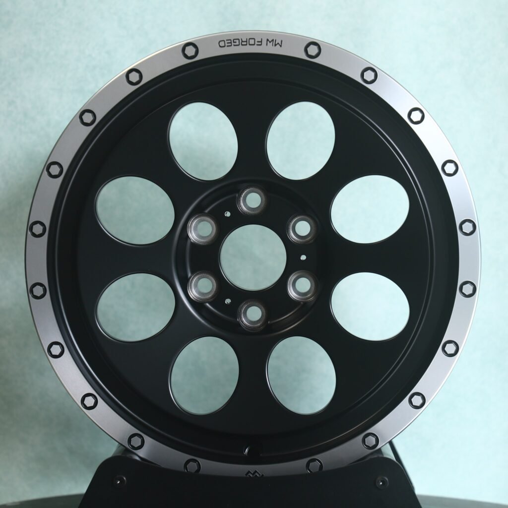 Lexus LX wheels – Matte Black Round-Window Bolted Ring, angled view