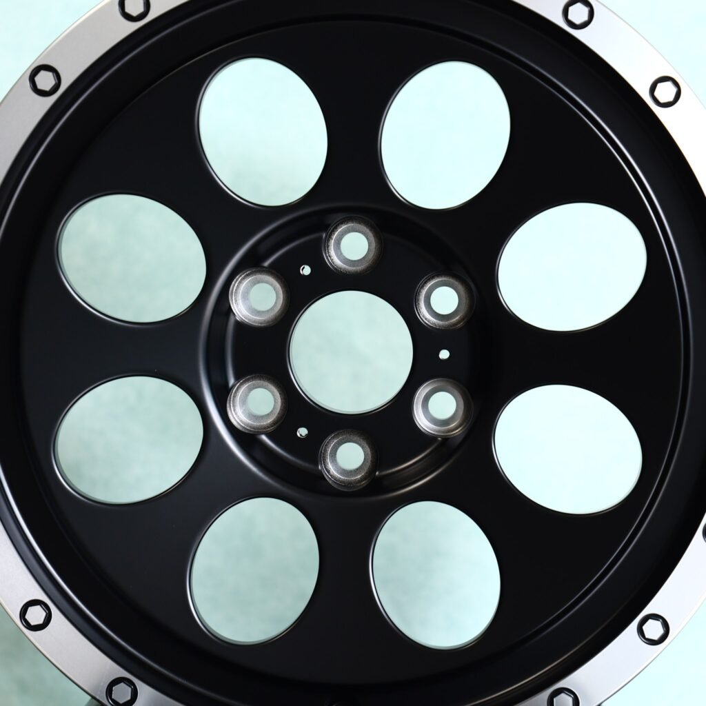 Toyota Tacoma wheels – Matte Black Round-Window Bolted Ring, lip and barrel detail