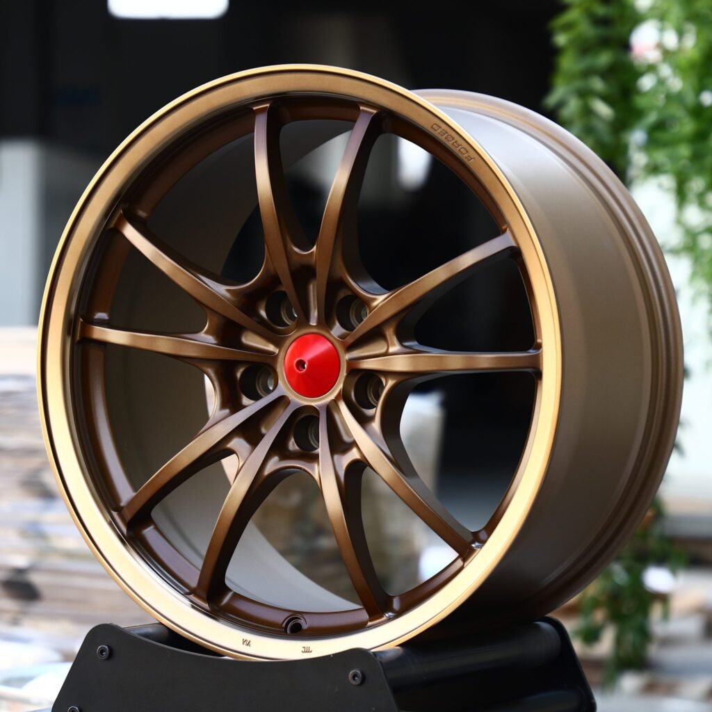 Toyota Highlander wheels – Matte Bronze 10-Spoke Red Cone Cap, angled view