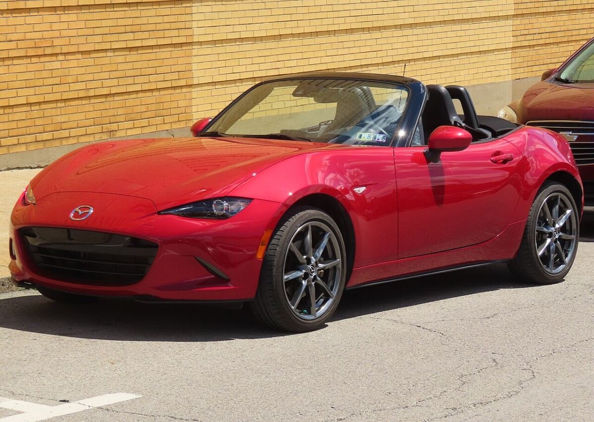 Fourth-generation Mazda MX-5 (ND) roadster in red, front left view of the 4x100 car