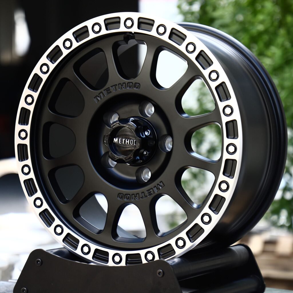 Land Rover Defender wheels – Matte Black Machined Bolt Ring 12-Spoke (Method-Style), angled view