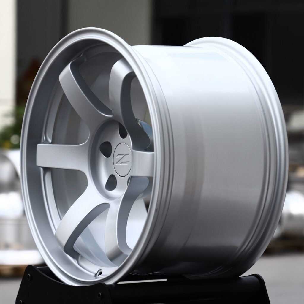 5x114.3 wheels – Matte Silver 6-Spoke (Nissan OEM-Style), side view