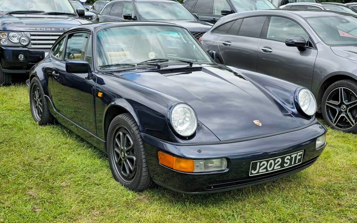 Dark blue 1991 Porsche 911 964 Carrera 4 coupe with five-spoke wheels, 5x130 bolt pattern