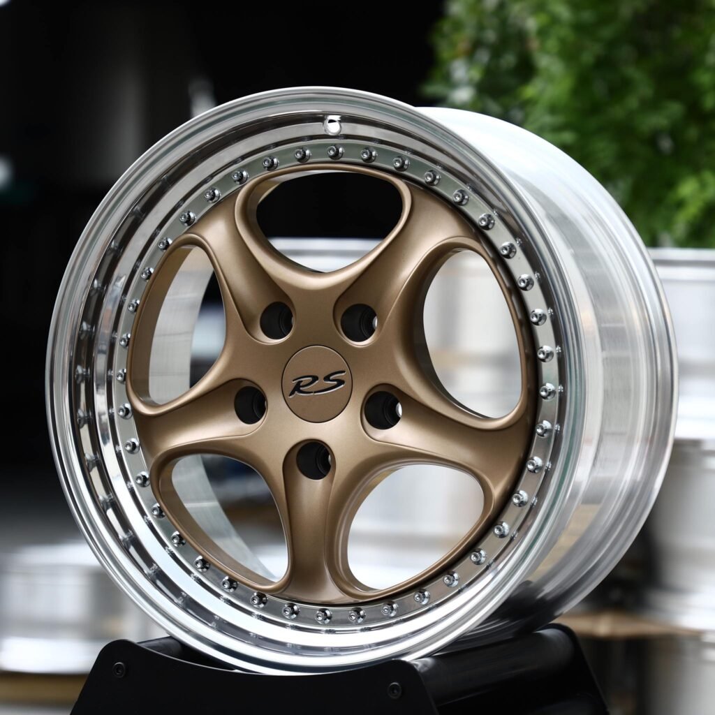 Porsche Panamera wheels – 2-Piece Bronze 5-Spoke Riveted Lip (Porsche OEM-Style), angled view