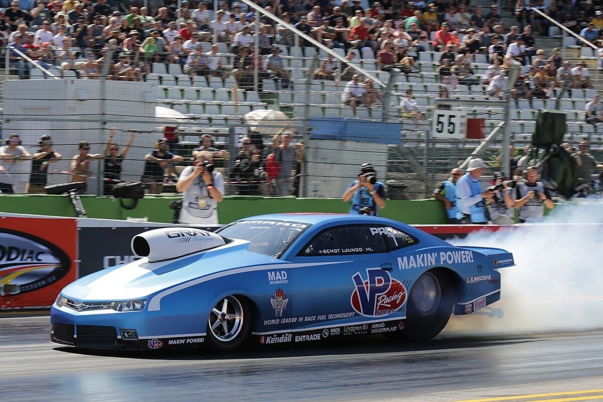 Pro Stock Camaro at launch with narrow front runner wheels and wide high-backspace rear slick wheels