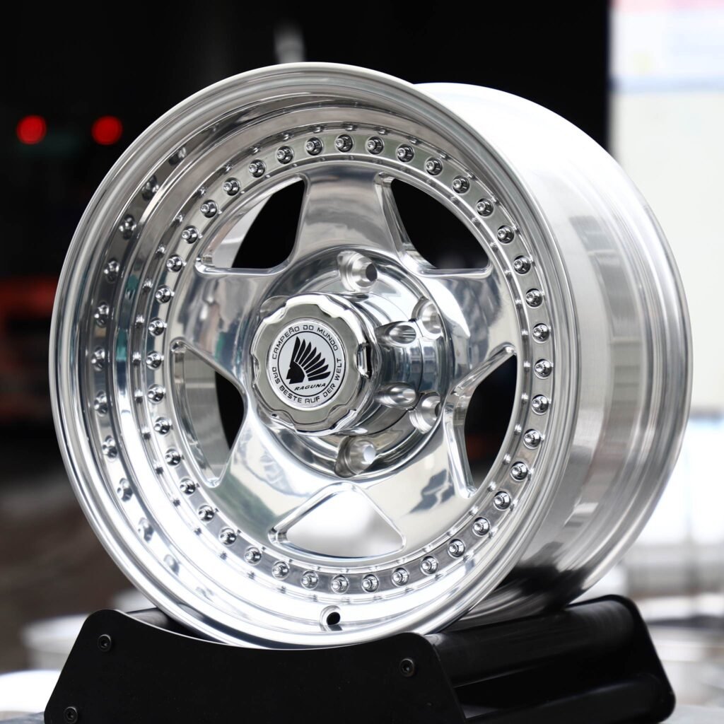 Land Rover Defender wheels – 2-Piece Polished 5-Spoke Riveted Lip (Raguna-Style), angled view