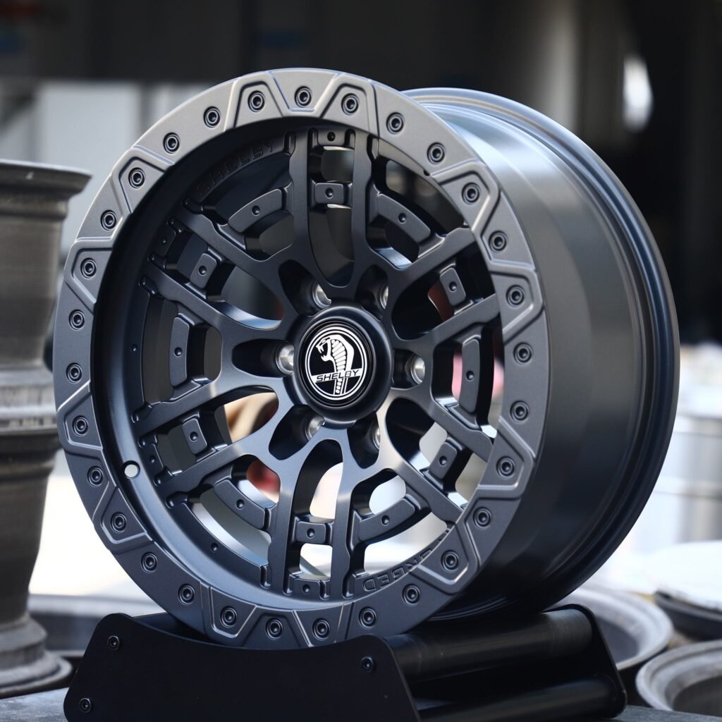 Ford Bronco wheels – Gunmetal / Black Split-Spoke Beadlock (Shelby-Style), angled view