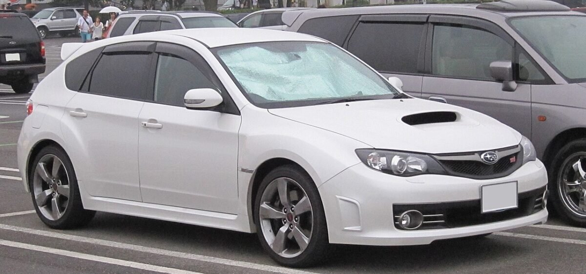 Third-generation Subaru Impreza WRX STI hatchback (GR) in white, front three-quarter view