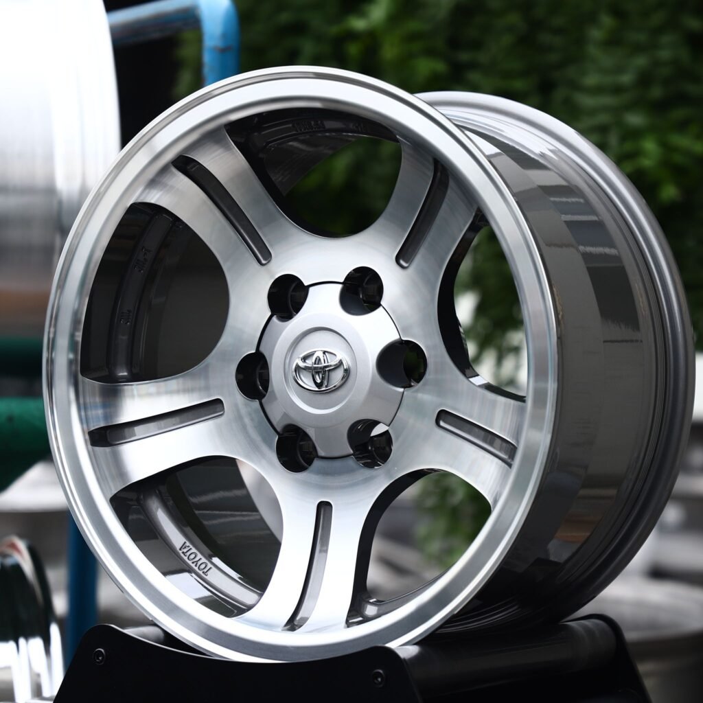 Toyota Tacoma wheels – Black / Machined 5 Split-Spoke (Toyota OEM-Style), angled view