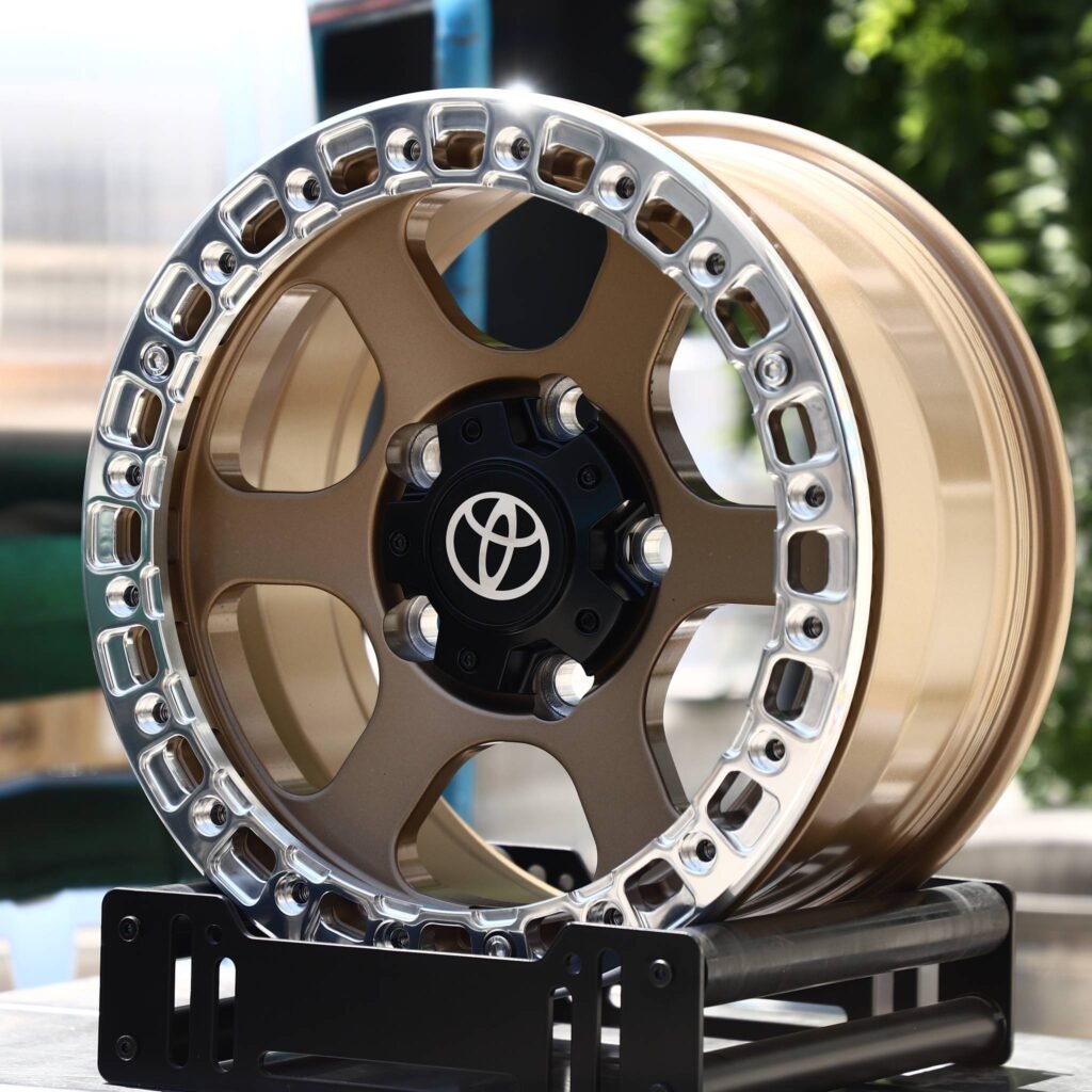 Toyota Tacoma wheels – Bronze 6-Spoke Polished Ring Beadlock (Toyota OEM-Style), angled view