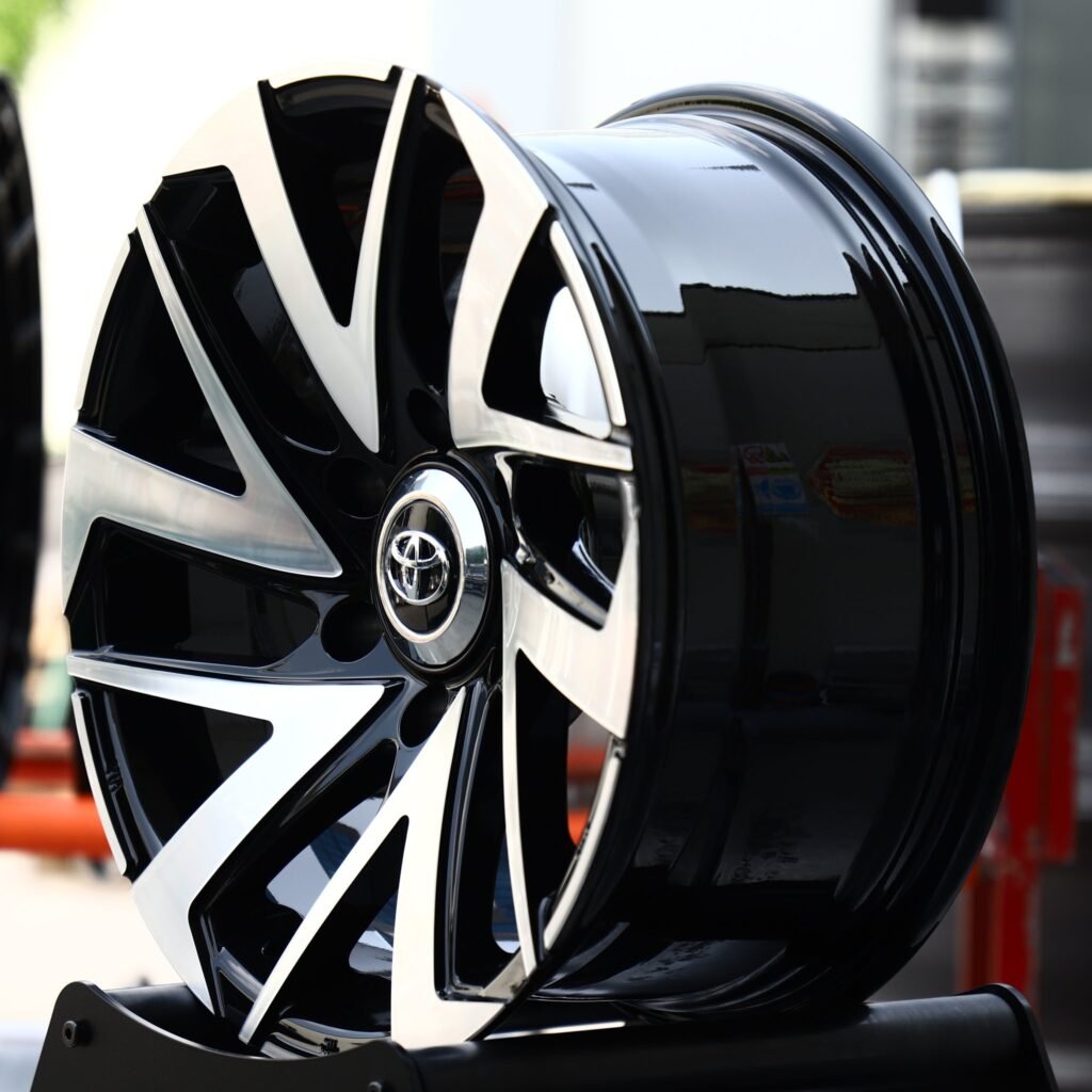 6x139.7 wheels – Gloss Black Machined Directional Blade (Toyota OEM-Style), side view