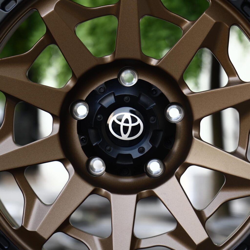 Toyota Sequoia wheels – Matte Bronze 10-Spoke Black-Ring Beadlock (Toyota OEM-Style), lip and barrel detail