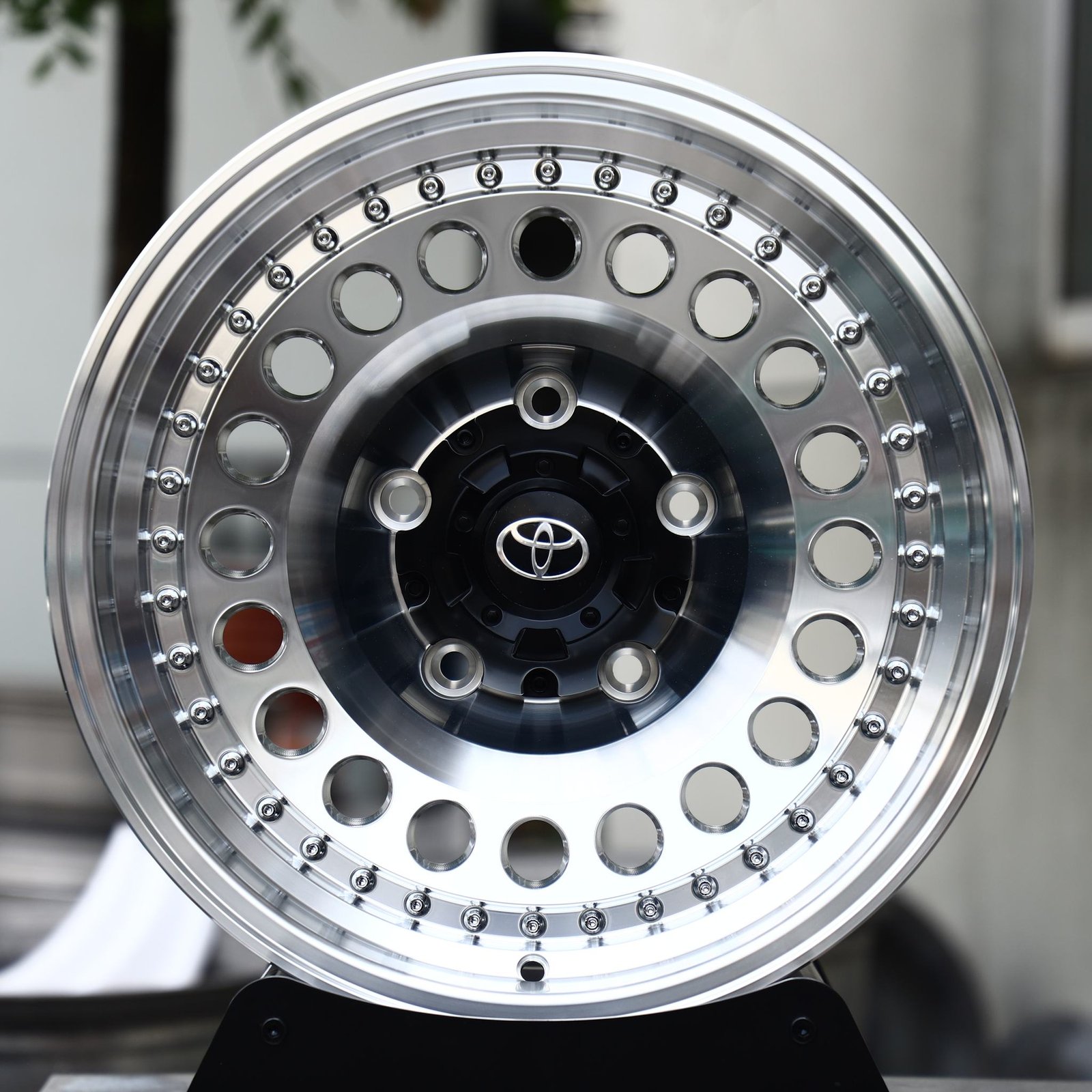 Toyota Land Cruiser wheels – Polished / Black Riveted Round-Hole Dish (Toyota OEM-Style), front view
