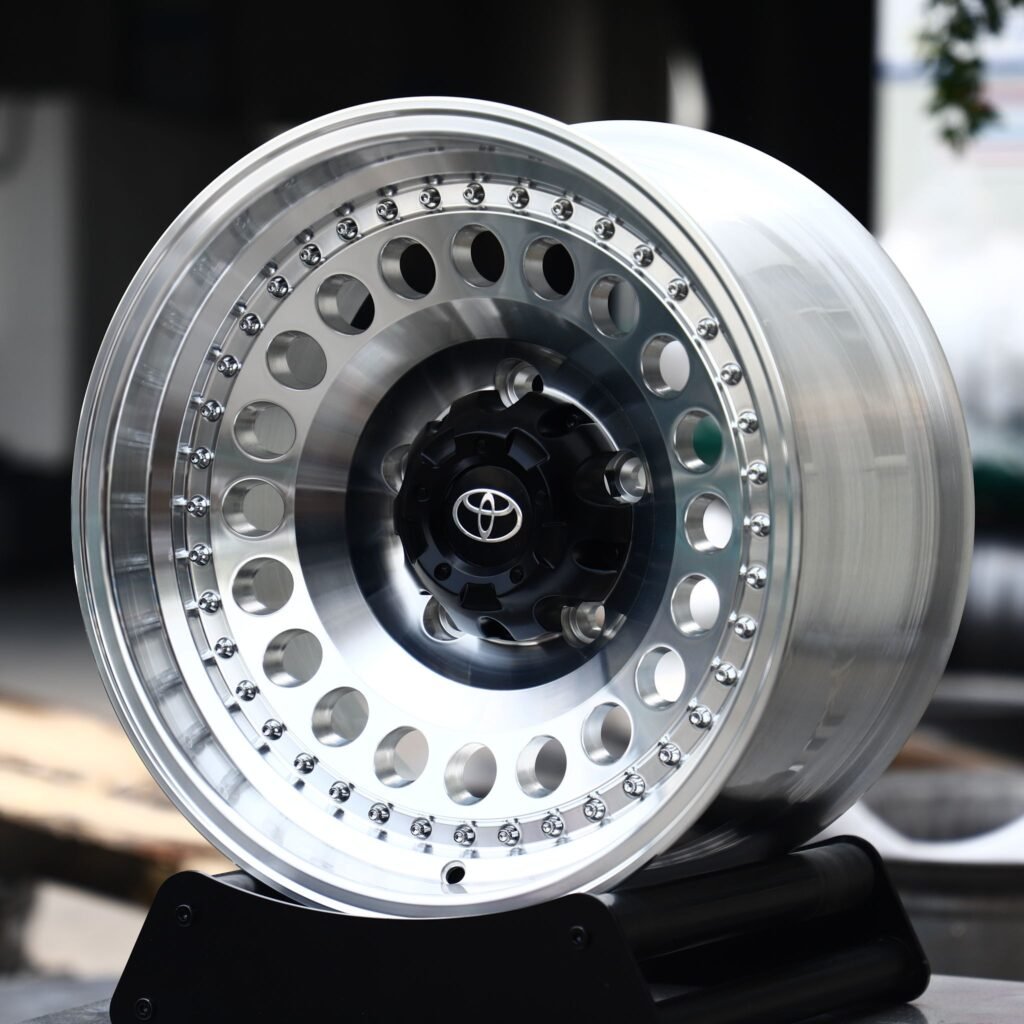 Toyota 4Runner wheels – Polished / Black Riveted Round-Hole Dish (Toyota OEM-Style), angled view