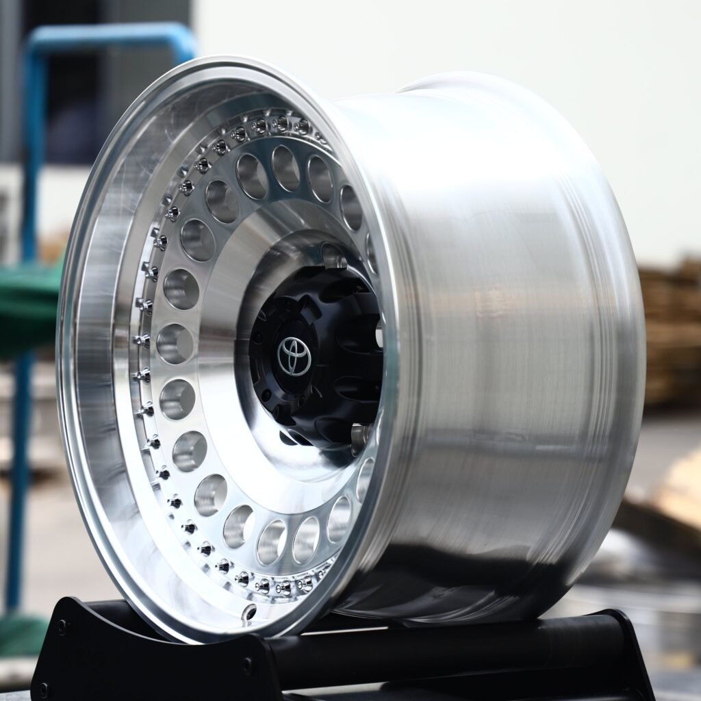 6x139.7 wheels – Polished / Black Riveted Round-Hole Dish (Toyota OEM-Style), side view