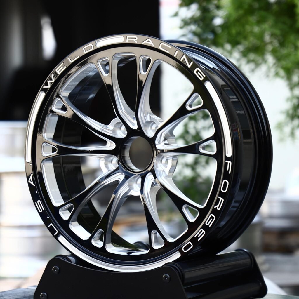 Dodge Challenger wheels – Black Machined 10-Spoke Lettered Lip (Weld Racing-Style), angled view