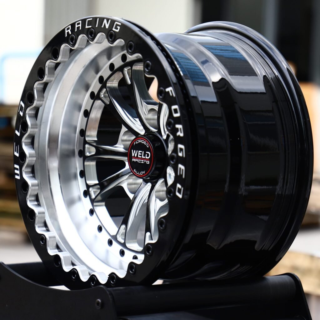 5x114.3 wheels – Black Machined Beadlock 10-Spoke Riveted Ring (Weld Racing-Style), side view