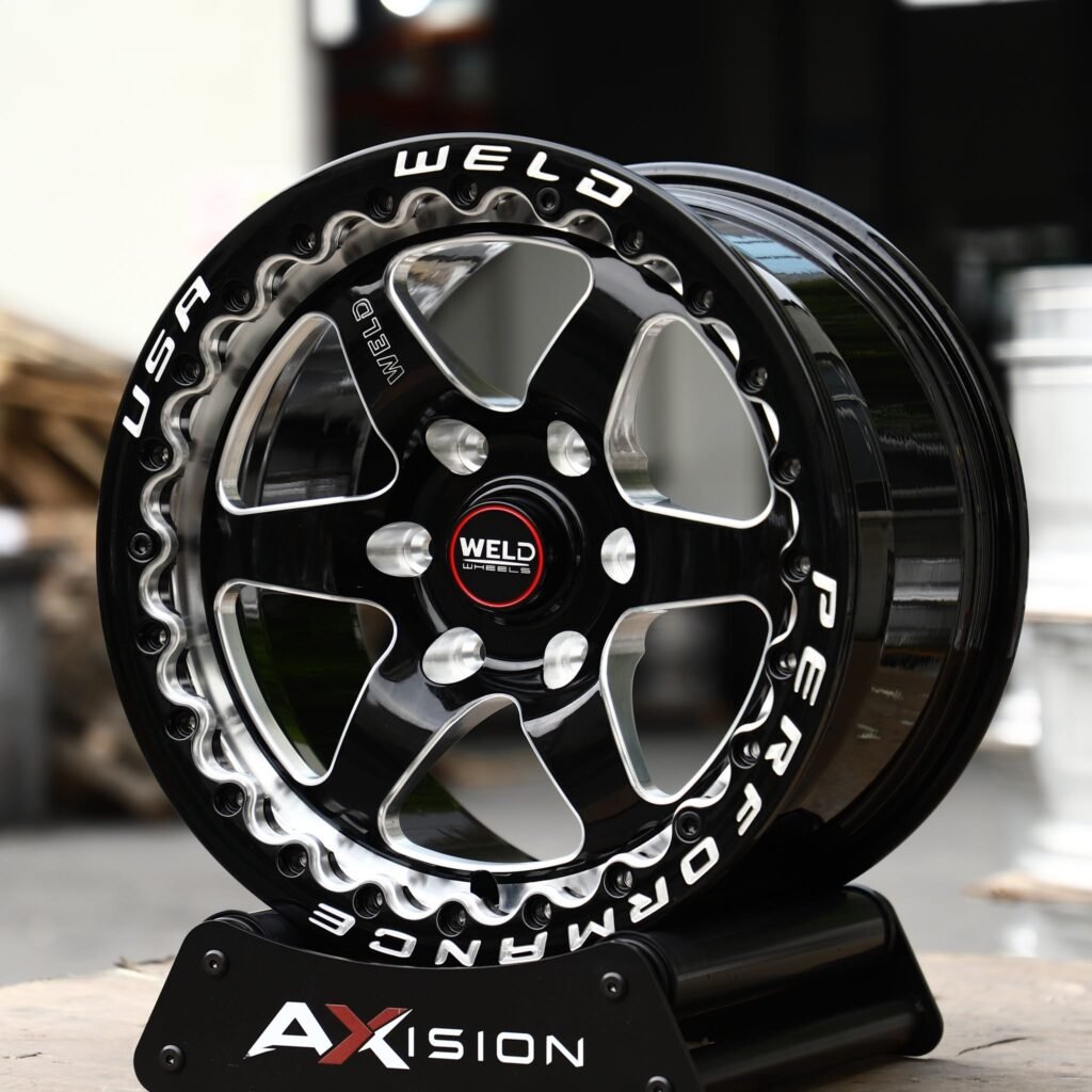 Toyota Tacoma wheels – Black Machined Beadlock 6-Spoke (Weld Racing-Style), angled view