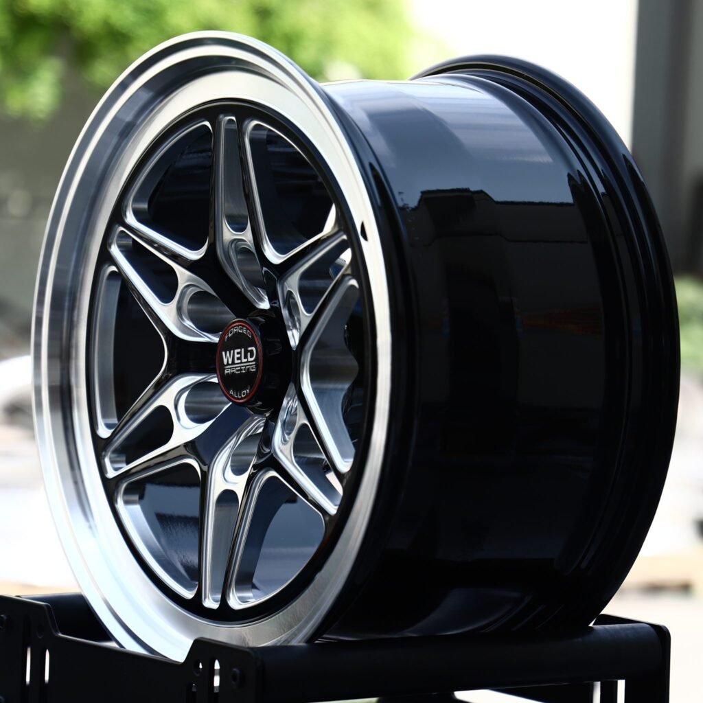 Chevrolet Silverado 1500 wheels – Gloss Black Milled Twin-Spoke Star Polished Lip (Weld Racing-Style), angled view