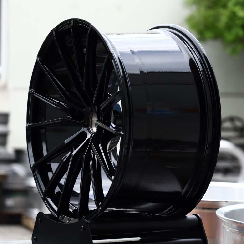 Toyota Camry wheels – Gloss Black 15-Spoke (Wheelforce-Style), angled view